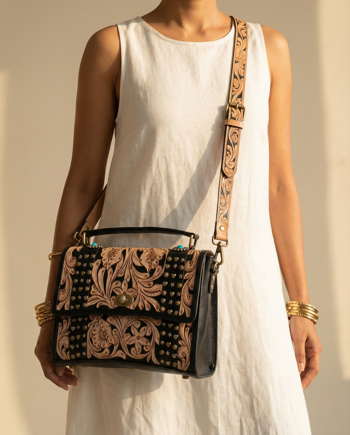 Midnight black tooled leather crossbody satchel worn by model by Ya Qalbi