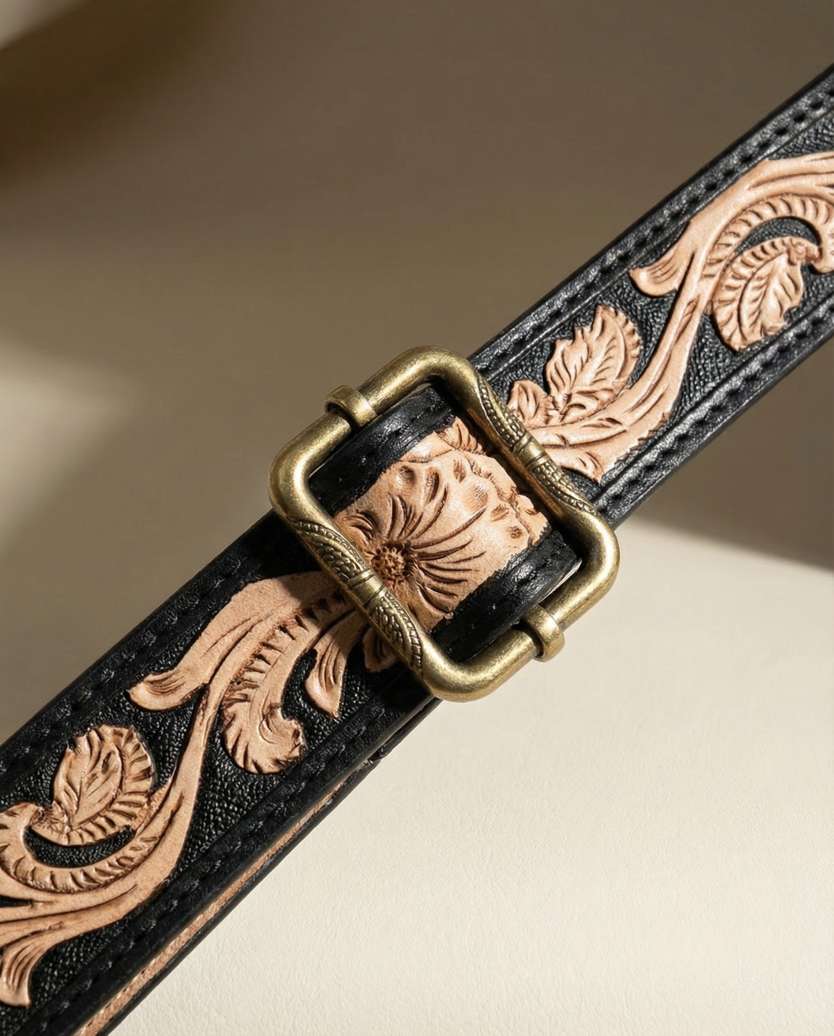 Hand-tooled black and natural leather strap with brass buckle by Ya Qalbi