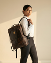 Genuine leather travel backpack with laptop compartment for women and men