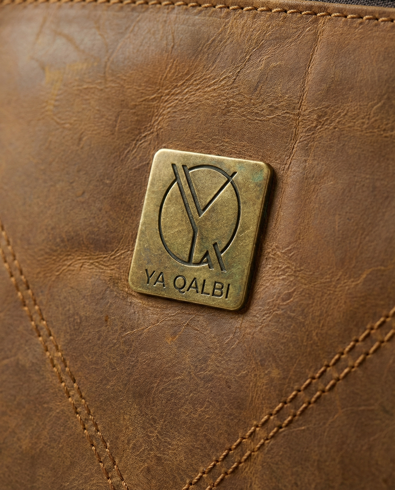 Brown leather travel backpack detail by Ya Qalbi