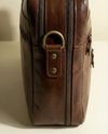 Rich brown leather laptop bag closeup detail by Ya Qalbi