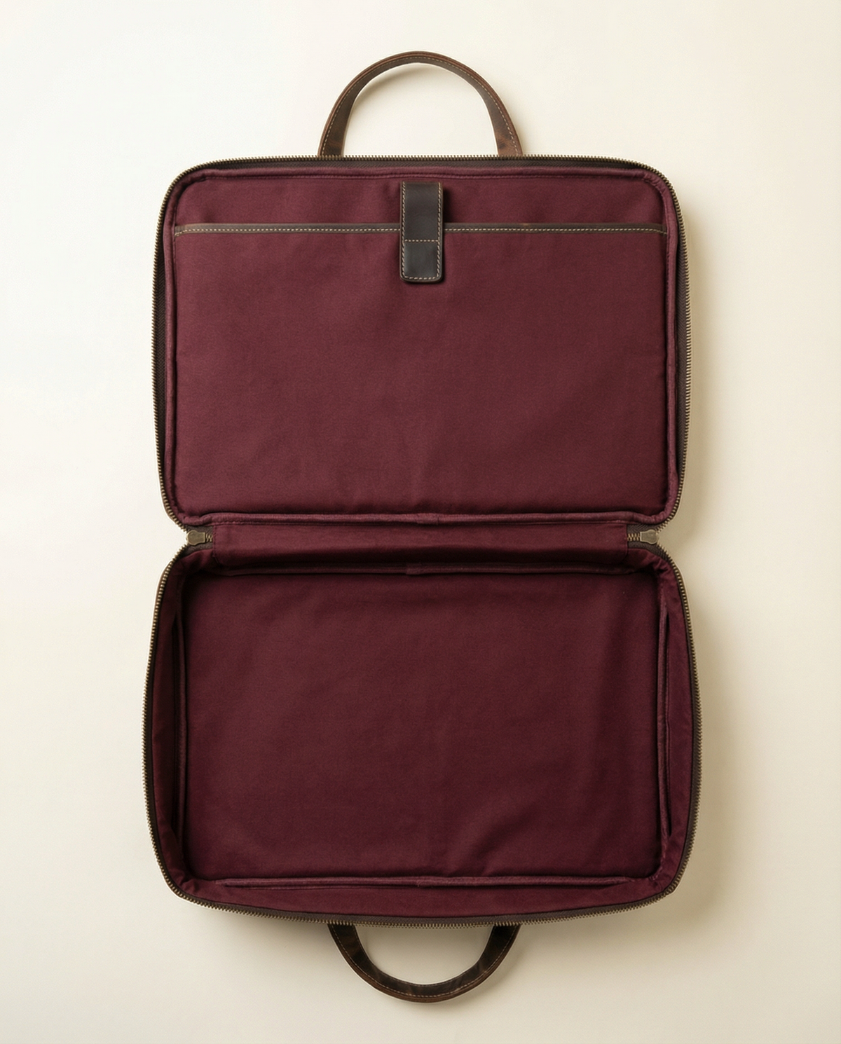 Open briefcase showing padded laptop compartment and wine lining