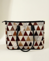 Full-grain leather tote bag with hair-on hide patchwork by Ya Qalbi