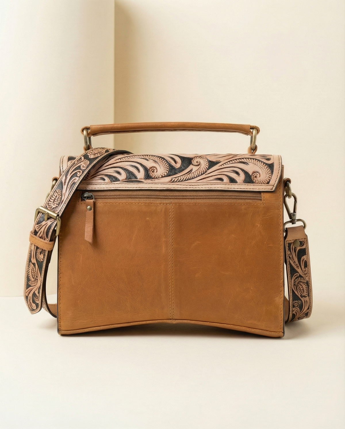 Tan tooled leather crossbody satchel with brass studs, back view, by Ya Qalbi