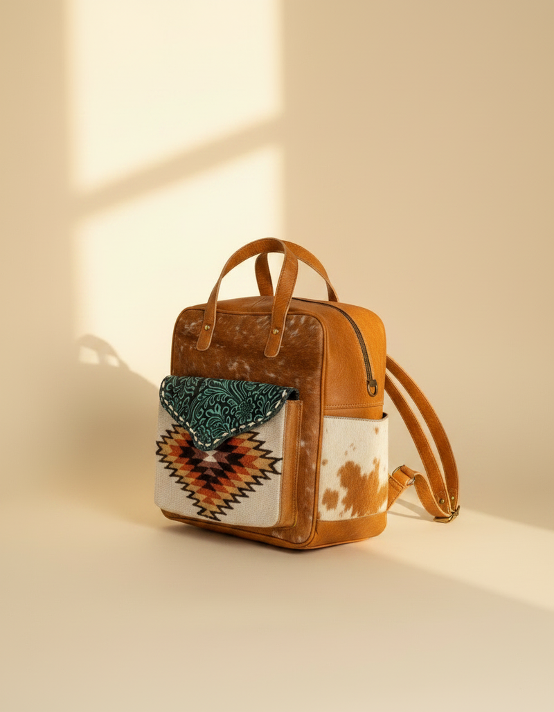 Unisex travel rucksack with leather trim and laptop compartment