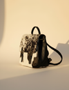 Black and White Hair-On Leather Flap Backpack – Brass Buckles