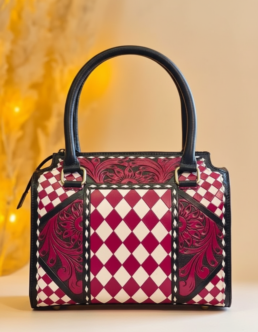 Burgundy harlequin hand-tooled leather barrel bag, angled view, by Ya Qalbi
