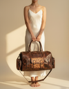 Hand-tooled leather duffle bag closeup detail by Ya Qalbi