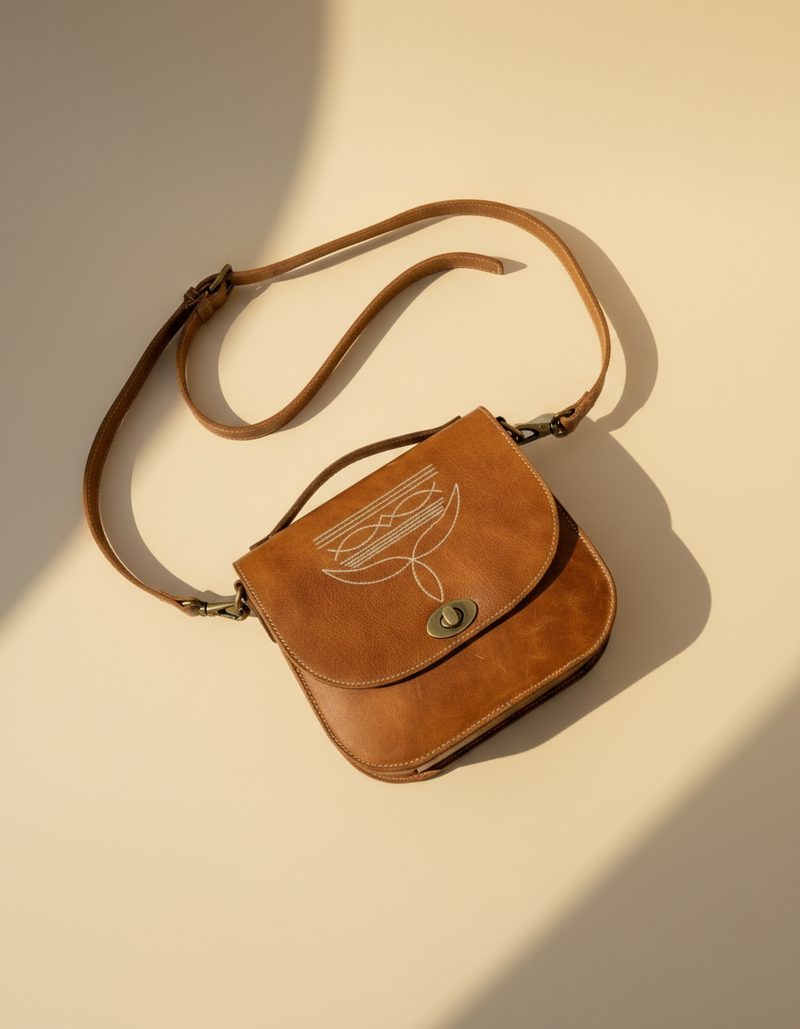 Tan Leather Bootstitch Saddle Bag – Twist-Lock Flap and Top Handle