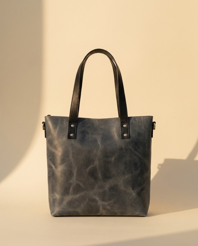 Blue leather work tote with laptop compartment by Ya Qalbi