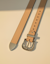 Full grain natural tan leather belt with rosette carving and silver western buckle set