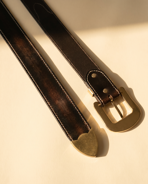 Full grain black leather belt with tan sunflower carving and antique brass buckle