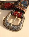 Handmade cowgirl belt with rose, leaf, and floral scroll painting on black leather
