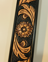 Full grain black leather belt with tan floral tooling and antique brass buckle