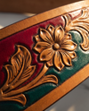 Full grain leather belt with red and green inlay and antique brass buckle set