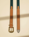 Full grain leather belt with green edges, tan floral carving, and silver buckle set