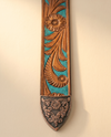 Handmade cowboy belt with hand carved feather and floral scrollwork