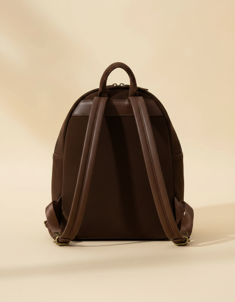 Dark brown suede backpack with white boot stitch embroidery, buckstitch lacing and tooled leather floral front pocket