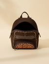 Dark brown suede backpack with white boot stitch embroidery, buckstitch lacing and tooled leather floral front pocket