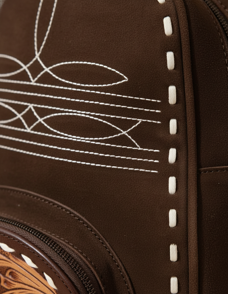 Dark brown suede backpack with white boot stitch embroidery, buckstitch lacing and tooled leather floral front pocket