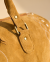 Tan Suede Bootstitch Duffle – Buckstitch Edges & Braided Pulls