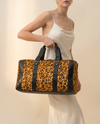 Golden Leopard Print Hair-On Duffle – Black Bands & Silver Hardware