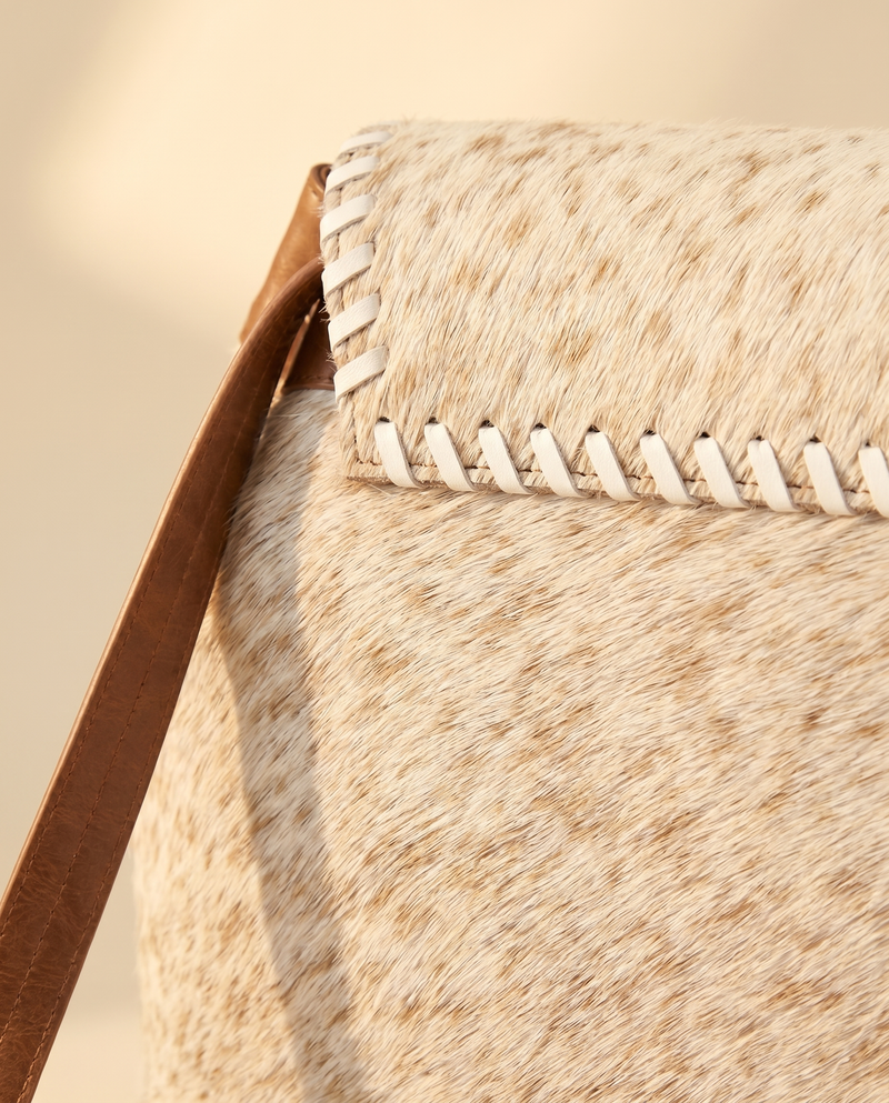 Cream and Tan Hair-On Leather Backpack – Silver Buckle Drawstring