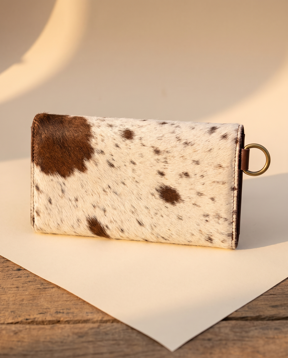 Brown cowhide wallet with curved hand-tooled flap, back view, by Ya Qalbi