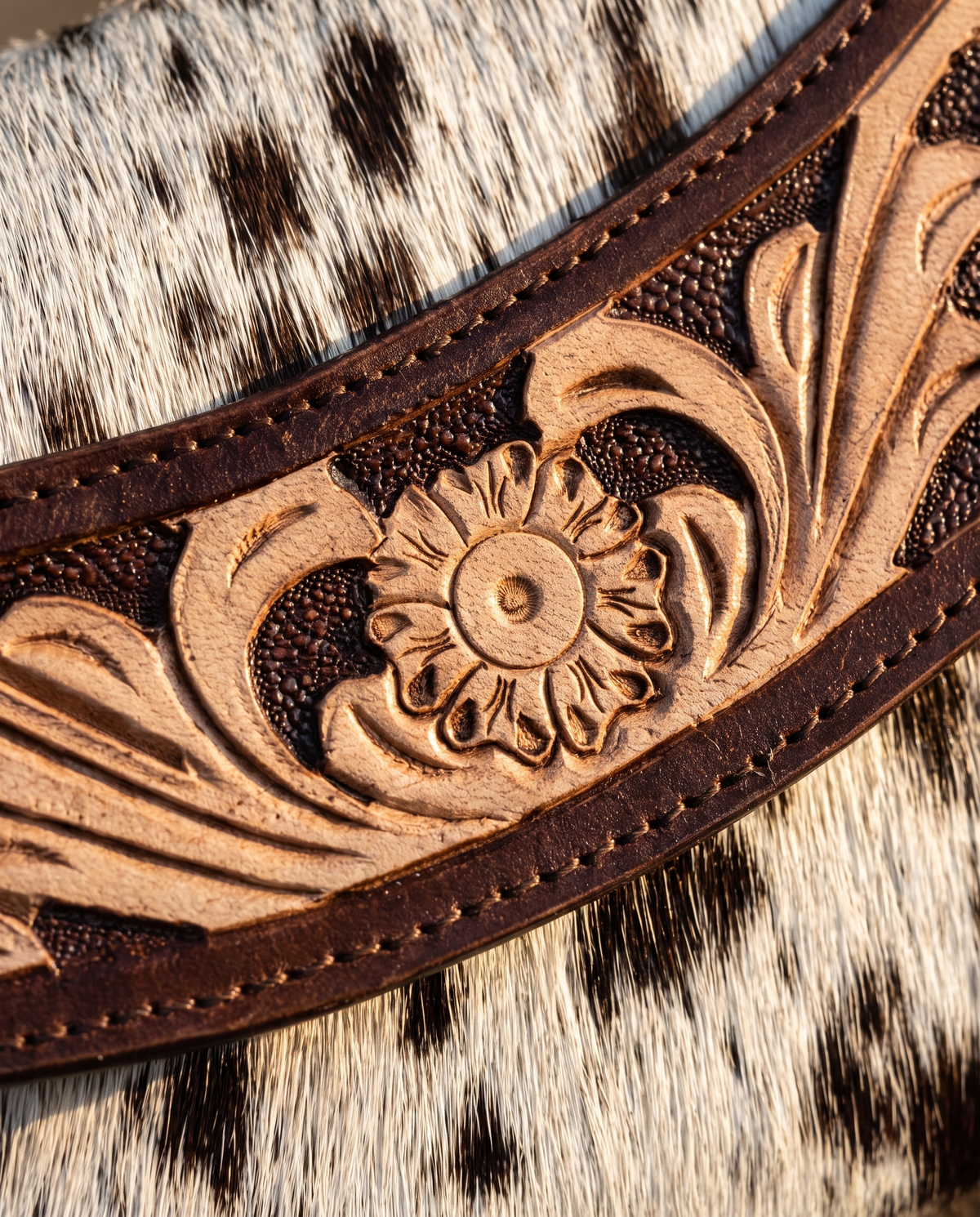 Brown cowhide wallet with curved hand-tooled flap, detail close-up, by Ya Qalbi