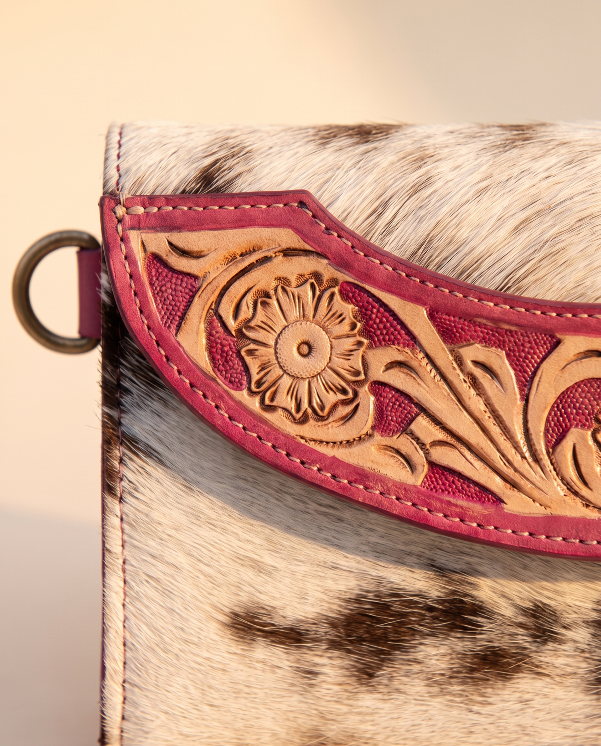 Pink cowhide wallet with curved hand-tooled flap, detail close-up, by Ya Qalbi