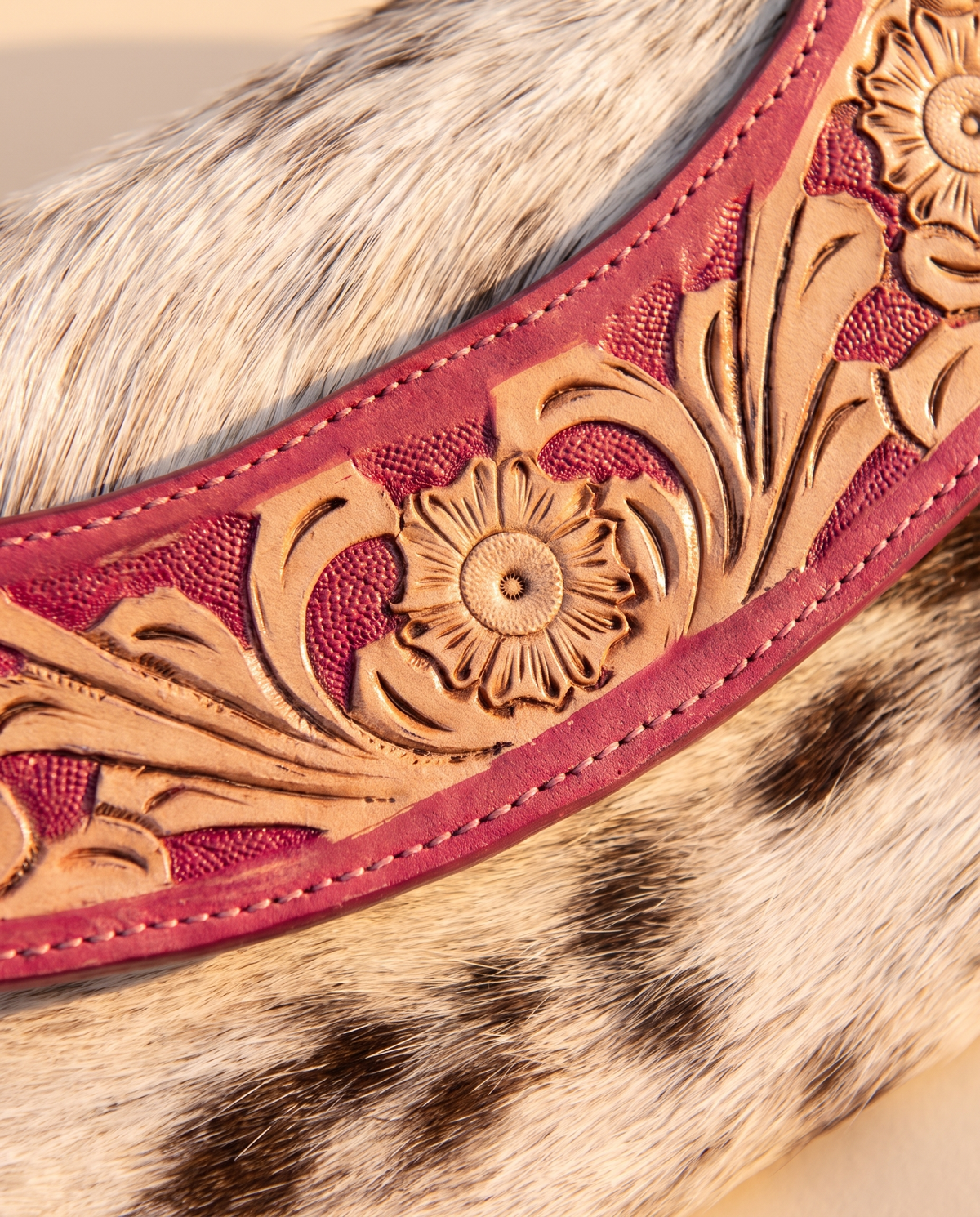 Pink cowhide wallet with curved hand-tooled flap, detail close-up, by Ya Qalbi