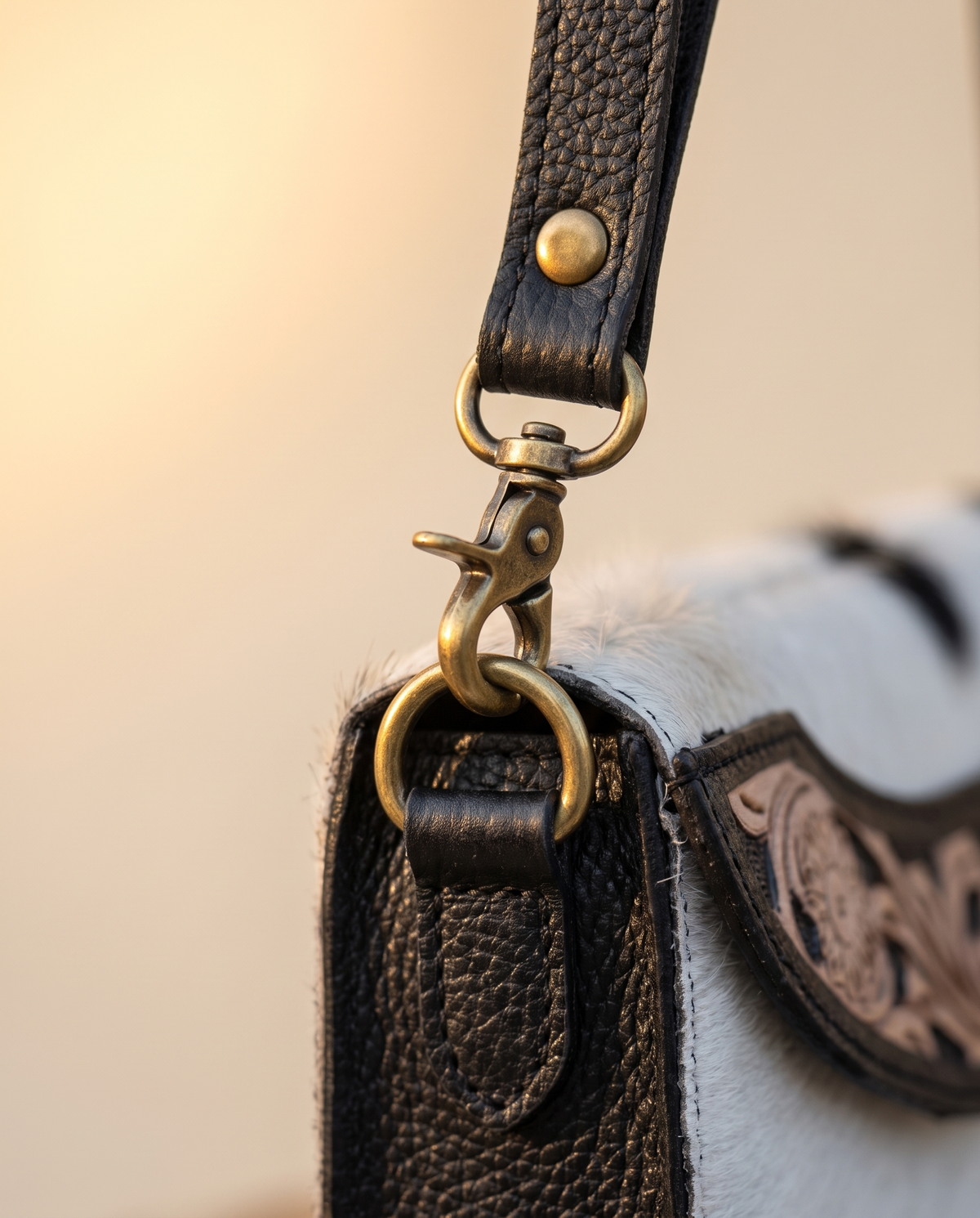 Black cowhide wallet with curved hand-tooled flap, detail close-up, by Ya Qalbi