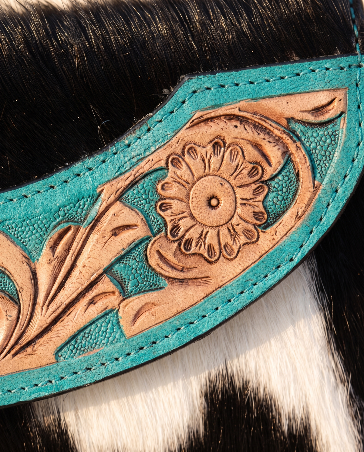 Turquoise cowhide wallet with curved hand-tooled flap, detail close-up, by Ya Qalbi
