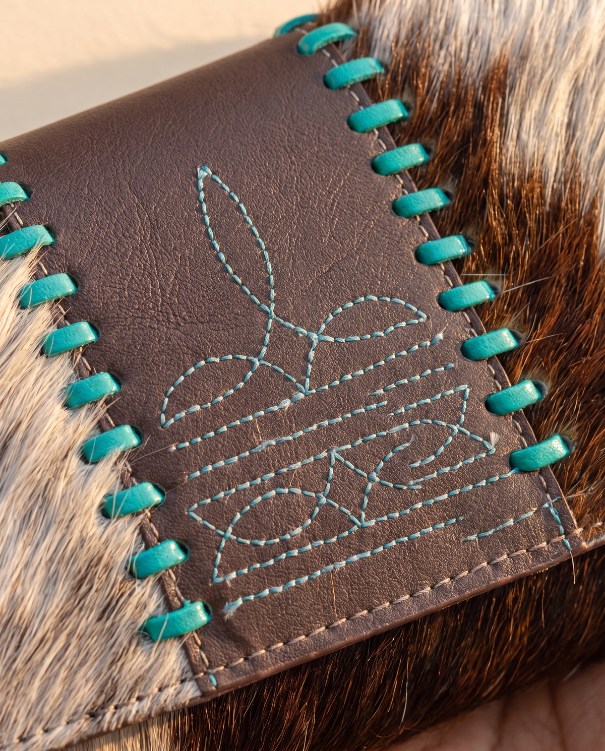 Brown and Turquoise cowhide wallet with bootstitch leather panel, detail close-up, by Ya Qalbi