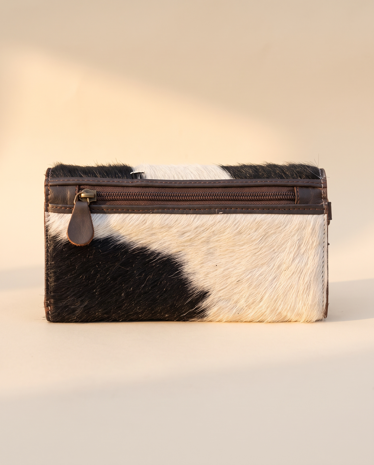 Black and White cowhide wallet with bootstitch leather panel, back view, by Ya Qalbi