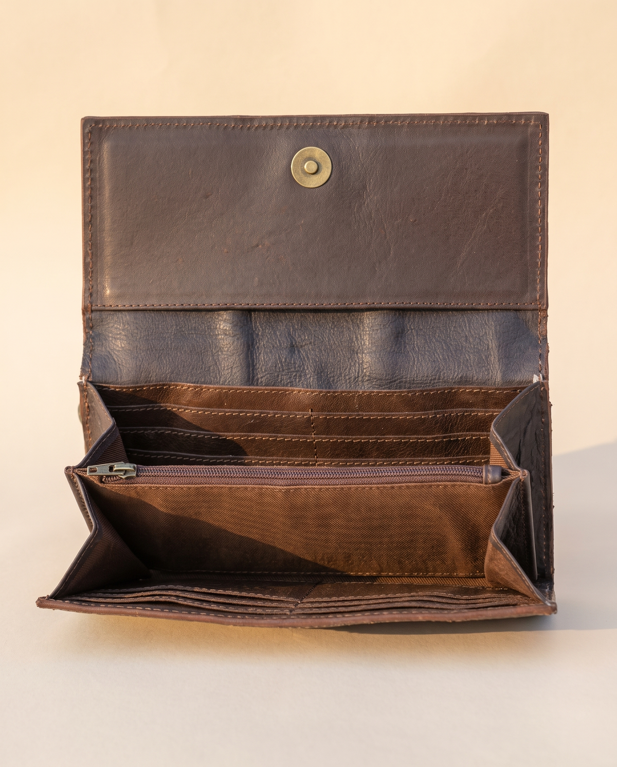 Black and White cowhide wallet with bootstitch leather panel, open interior view, by Ya Qalbi