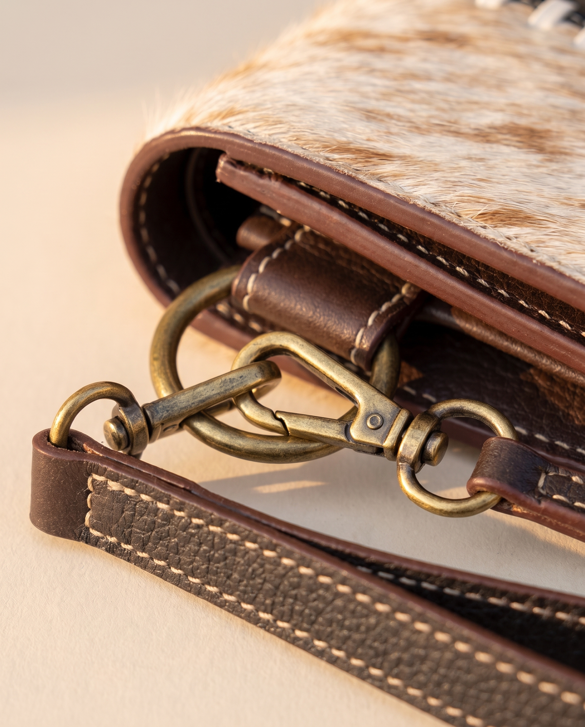 Tan and Black cowhide wallet with bootstitch leather panel, angled view, by Ya Qalbi