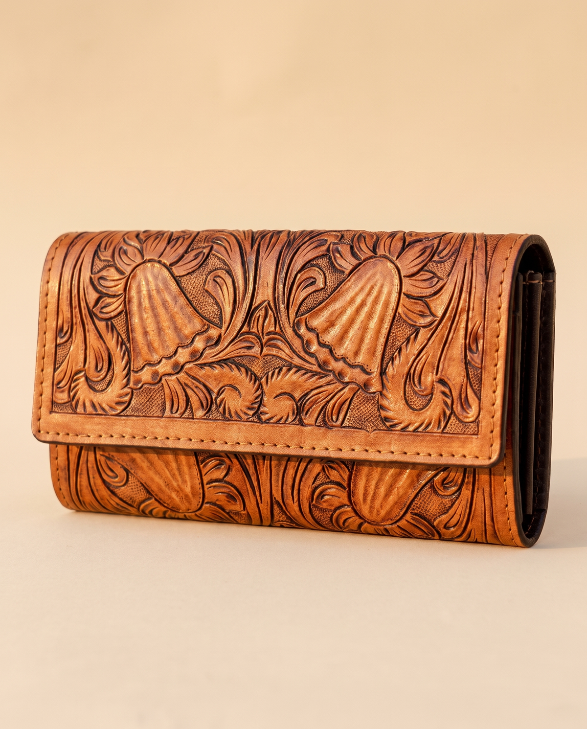 Tan hand-tooled leather zip wallet, front view, by Ya Qalbi