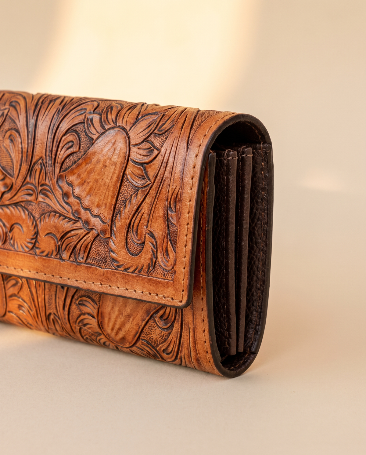 Tan hand-tooled leather zip wallet, detail close-up, by Ya Qalbi