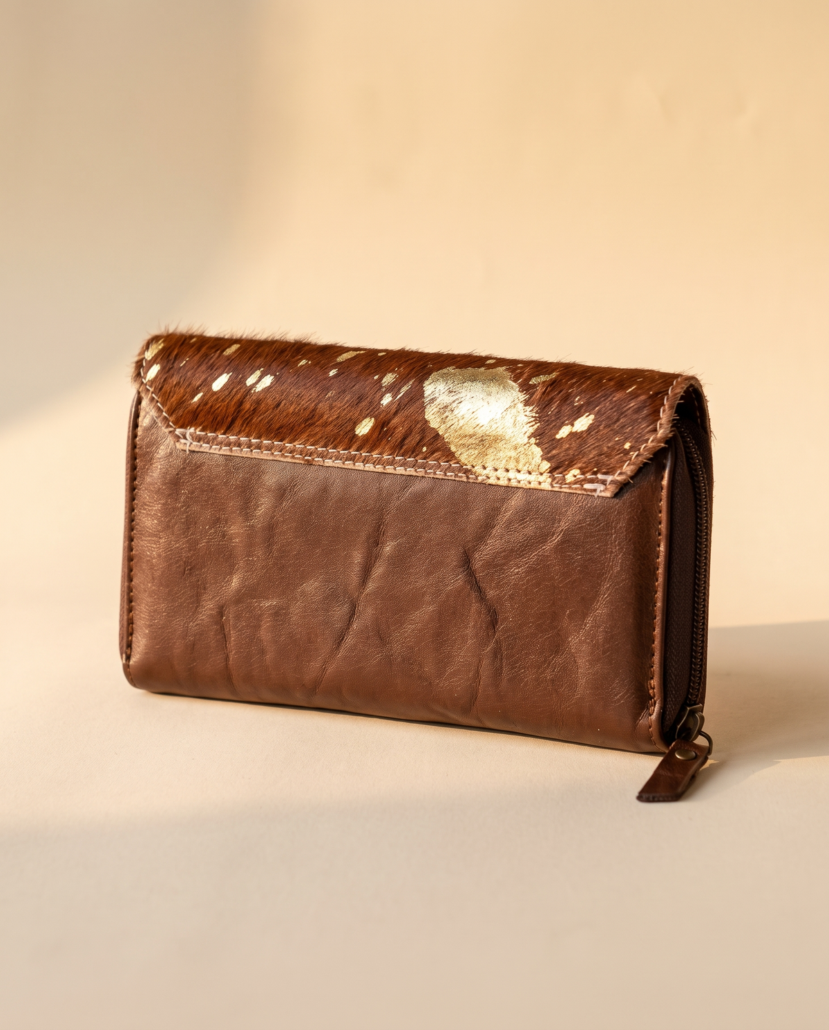 Cowhide wallet with scalloped hand-tooled flap, detail close-up, by Ya Qalbi