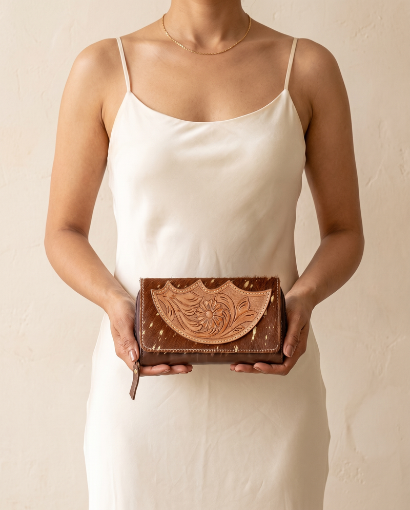 Cowhide wallet with scalloped hand-tooled flap, worn by a model, by Ya Qalbi