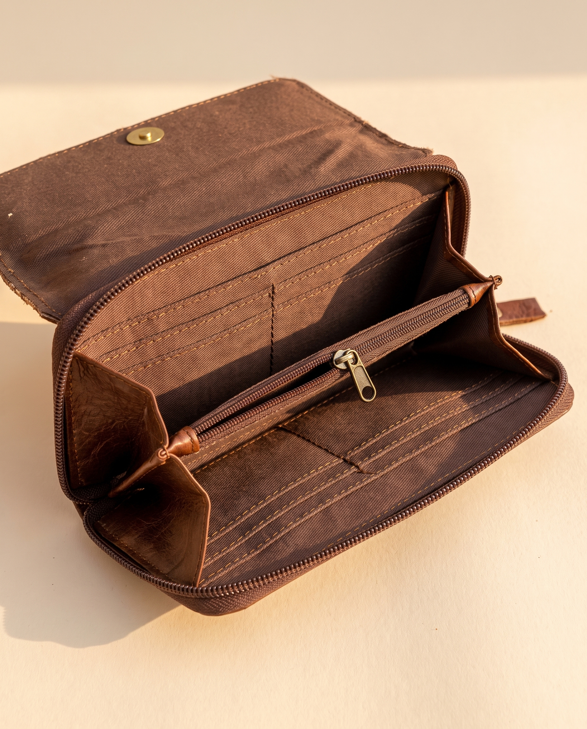 Cowhide wallet with scalloped hand-tooled flap, open interior view, by Ya Qalbi