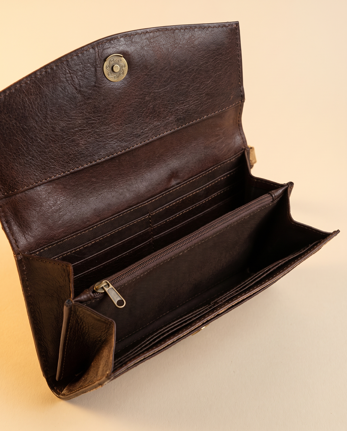 Cowhide wallet with hand-tooled frame, open interior view, by Ya Qalbi