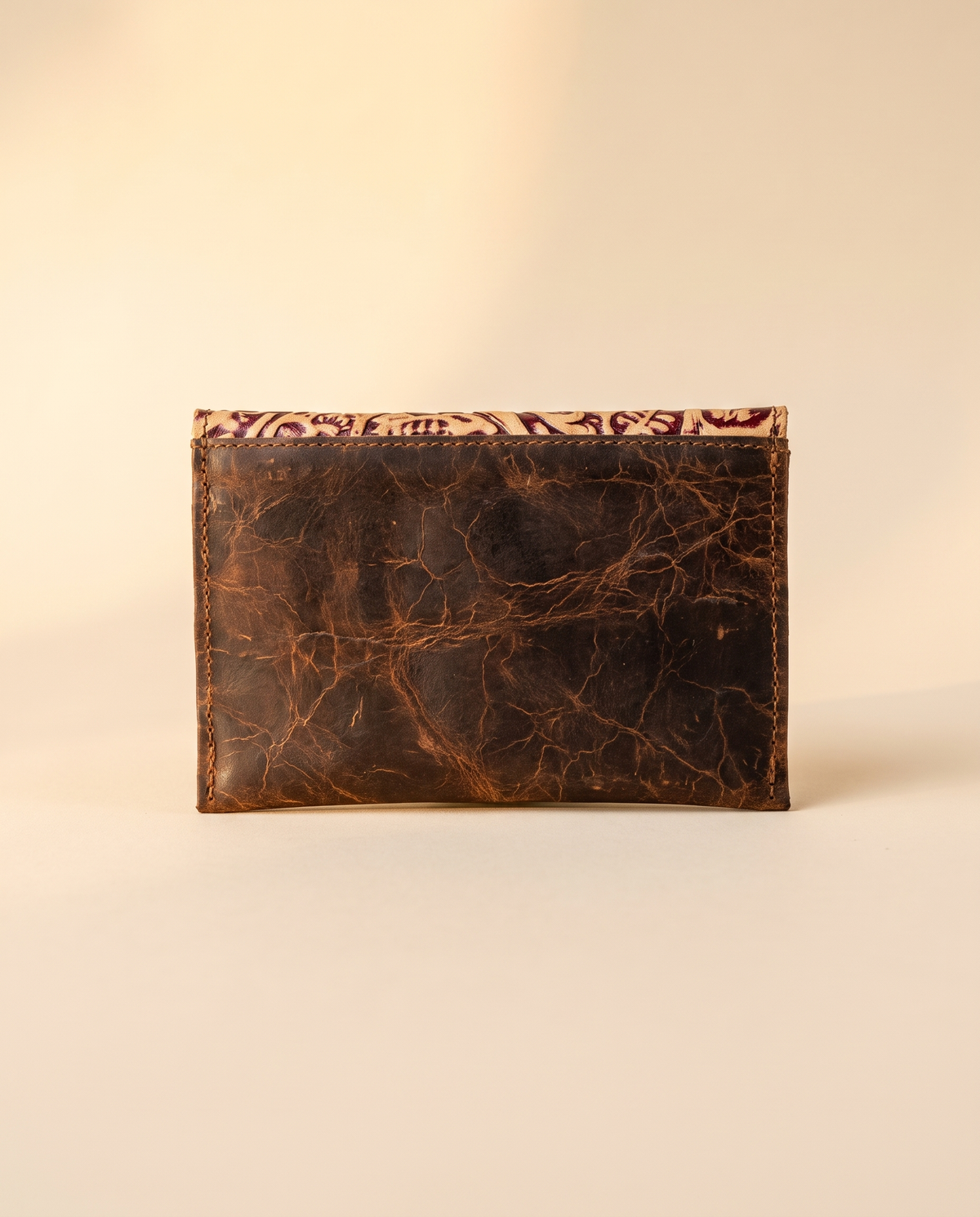 Crinkle brown leather wallet with tooled flap, detail close-up, by Ya Qalbi