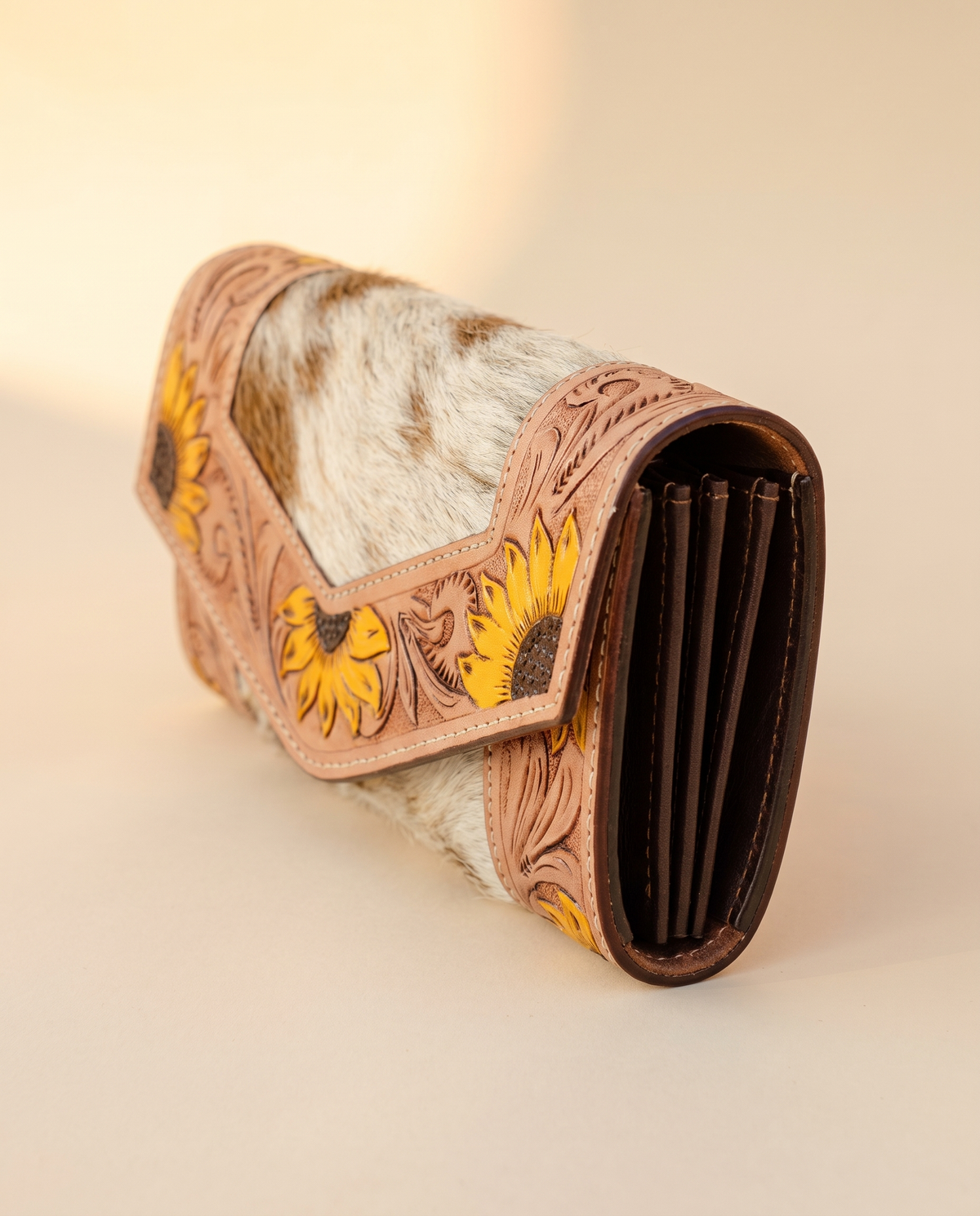 Cowhide envelope wallet with sunflower tooled frame, front view, by Ya Qalbi