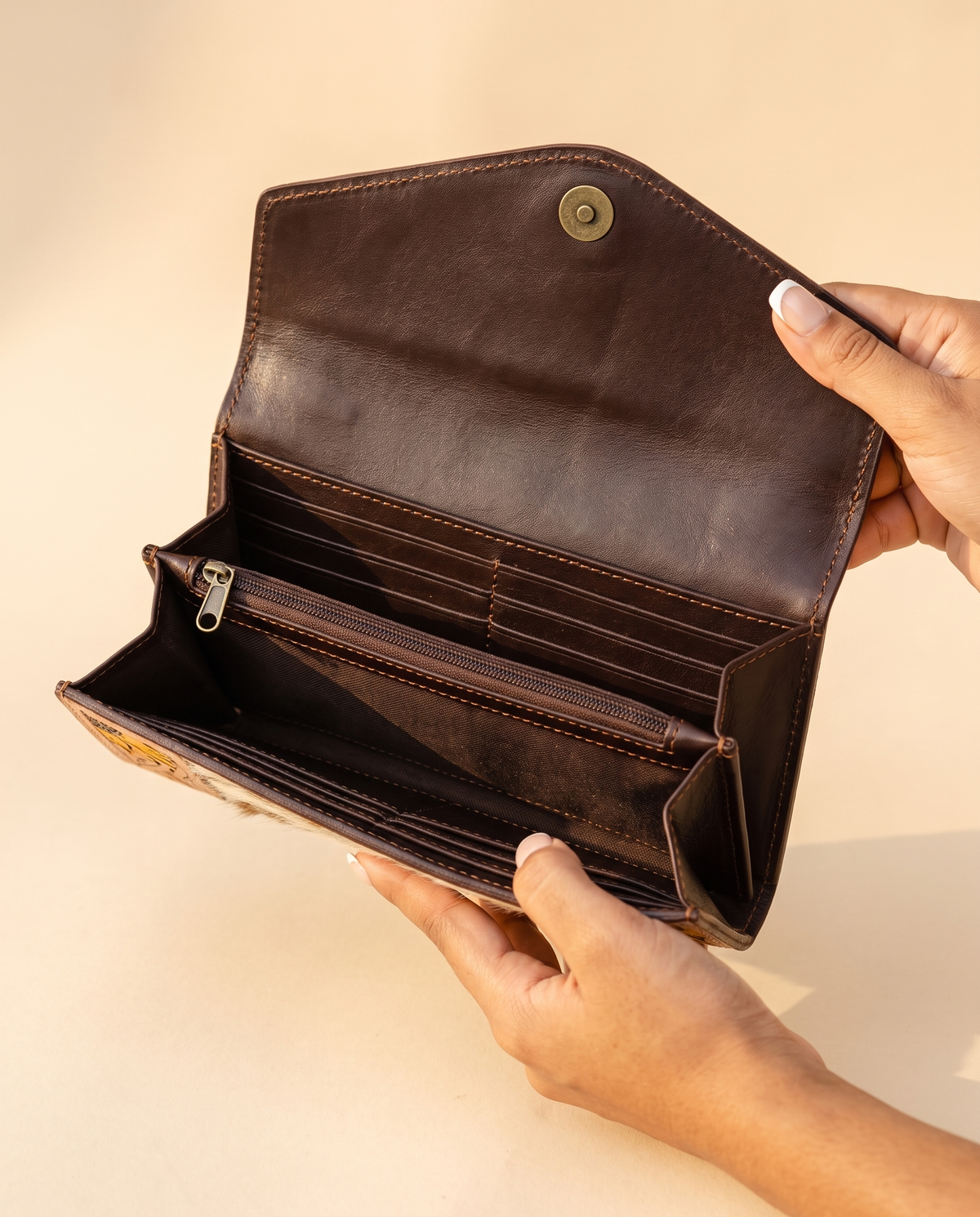 Cowhide envelope wallet with sunflower tooled frame, open interior view, by Ya Qalbi