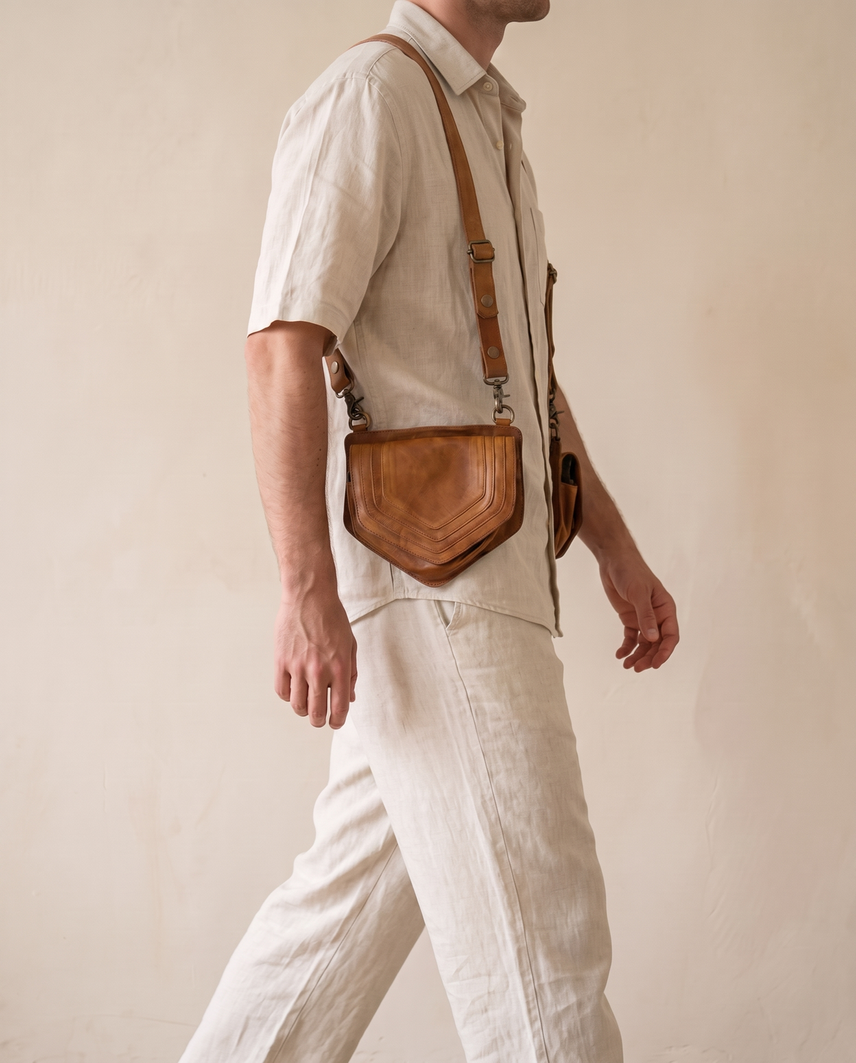 Tan leather harness bag pouch, worn crossbody by a model, by Ya Qalbi