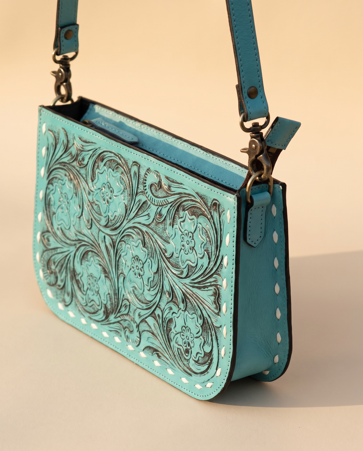 Turquoise tooled zip pouch, angled
