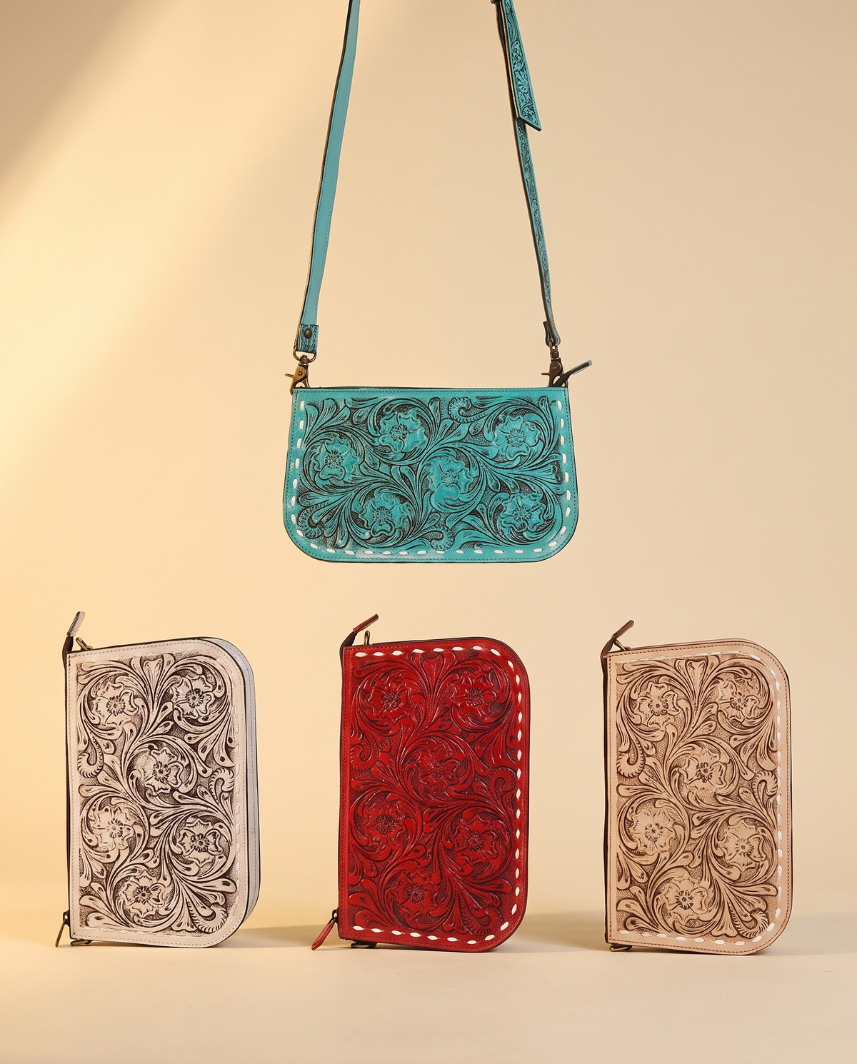 Tooled zip pouches in turquoise, cream, red and tan
