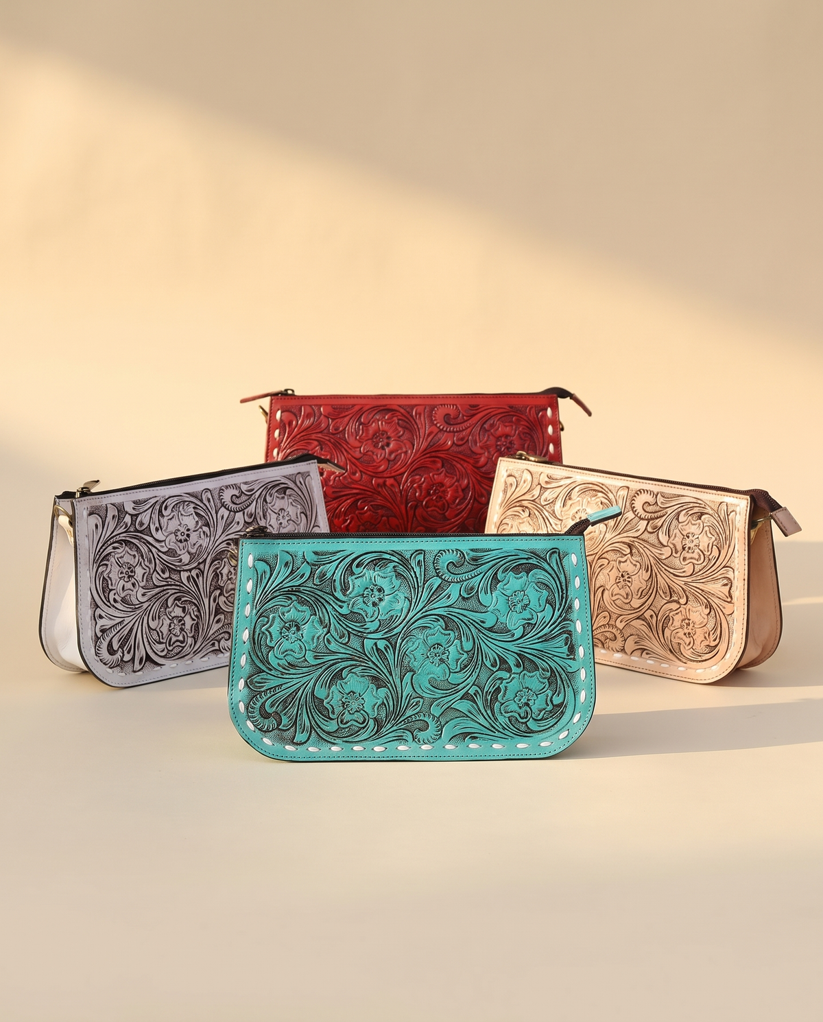 Tooled zip pouches in grey, red, turquoise and tan
